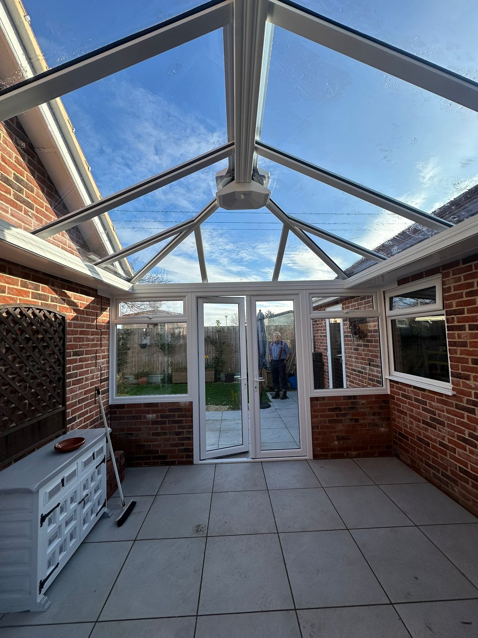 Conservatory interior looking up at a glass roof