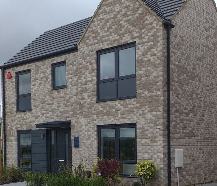 Modern house with anthracite grey windows and a composite door