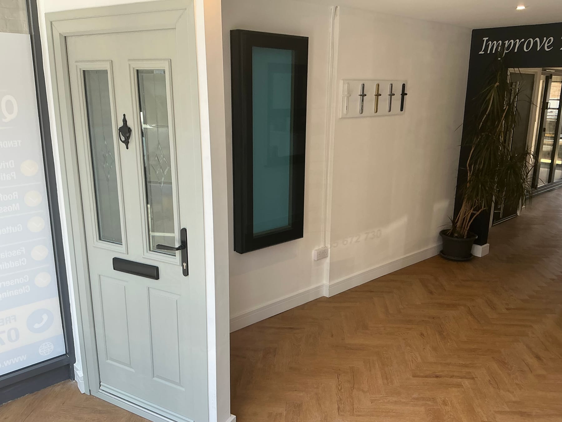 Grey composite door display and window samples in the IDM showroom